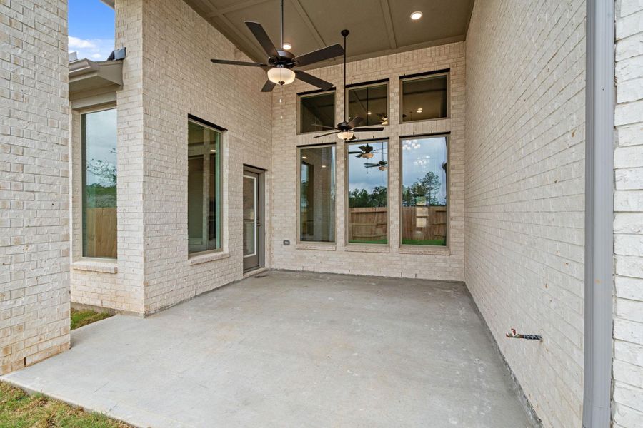 Exterior details and patio area of a home in Wildtree, Magnolia (Image 4).