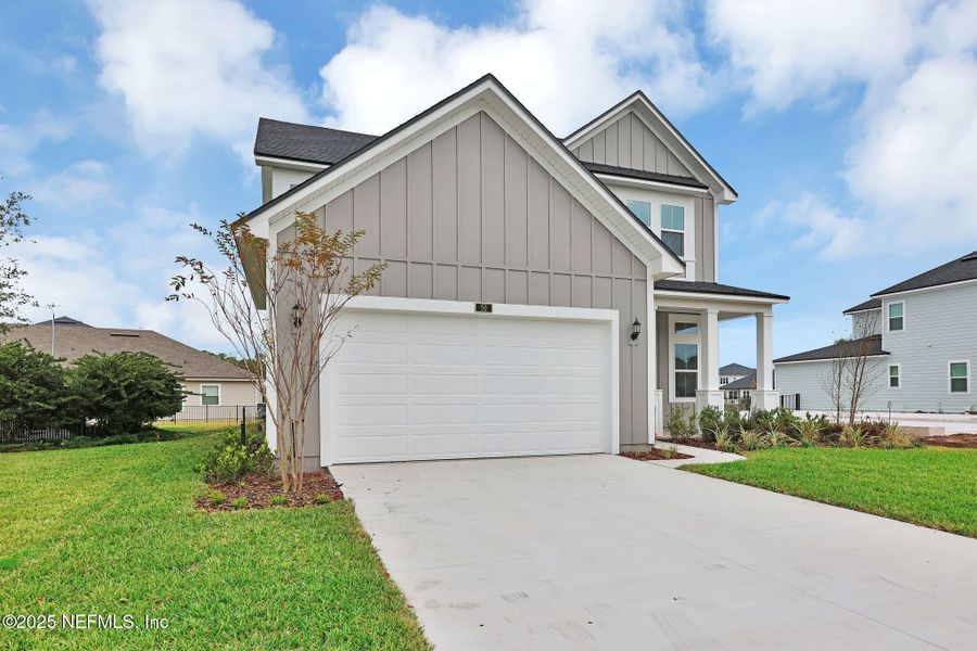 Front exterior of a new home in Reflections at Nocatee, Ponte Vedra, FL, highlighting curb appeal (Image 22).