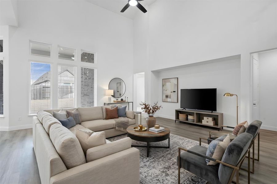 Enjoy the open and airy Family Room, designed for seamless entertaining and showcasing striking architectural details with high ceilings and durable flooring. *Virtually Staged Enjoy the open and airy Family Room, designed for seamless entertaining and showcasing striking architectural details with high ceilings and durable flooring. *Virtually Staged