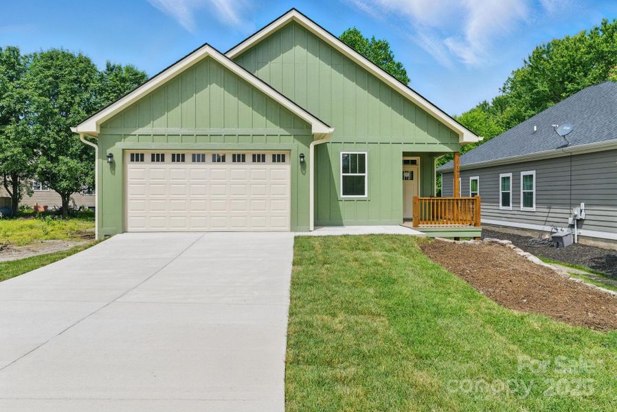 Front exterior of a new home in , Etowah, NC, highlighting curb appeal (Image 18). Front exterior of a new home in , Etowah, NC, highlighting curb appeal (Image 18).