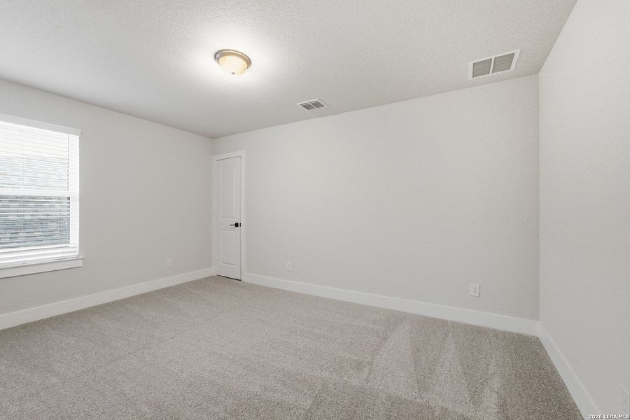 Spacious, unfurnished interior of a new home in The Woodlands at Medina Hills, Mico (Image 35).