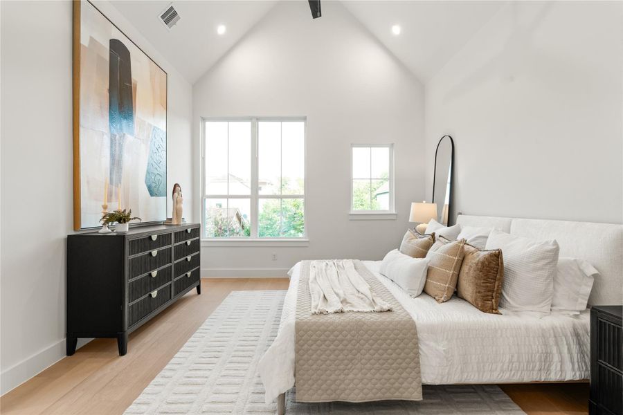 Primary bedroom features soaring cathedral ceilings, two separate large walk-in closets, and a drybar. Primary bedroom features soaring cathedral ceilings, two separate large walk-in closets, and a drybar.