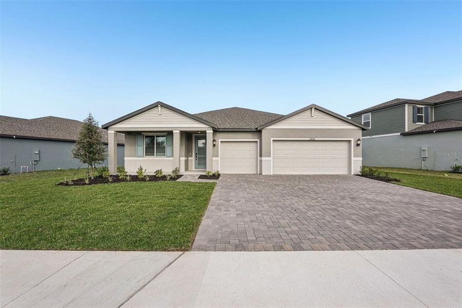 Front exterior of a new home in Oakfield Trails - Signature Series, Parrish, FL, highlighting curb appeal (Image 22).