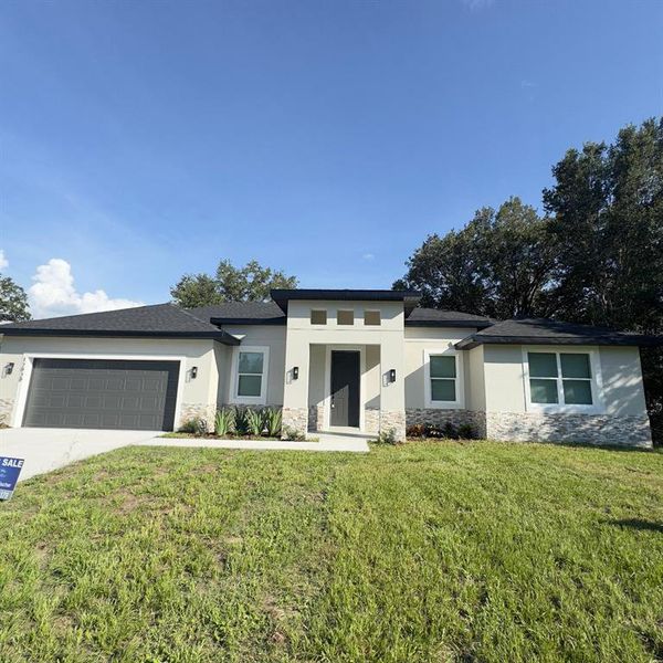Front exterior of a new home in , Ocala, FL, highlighting curb appeal (Image 2).