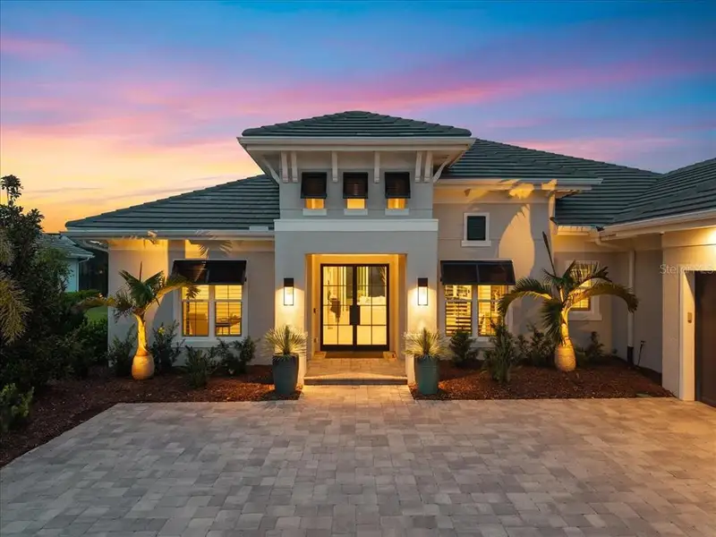 Front exterior of a new home in , Lakewood Ranch, FL, highlighting curb appeal (Image 27). Front exterior of a new home in , Lakewood Ranch, FL, highlighting curb appeal (Image 27).