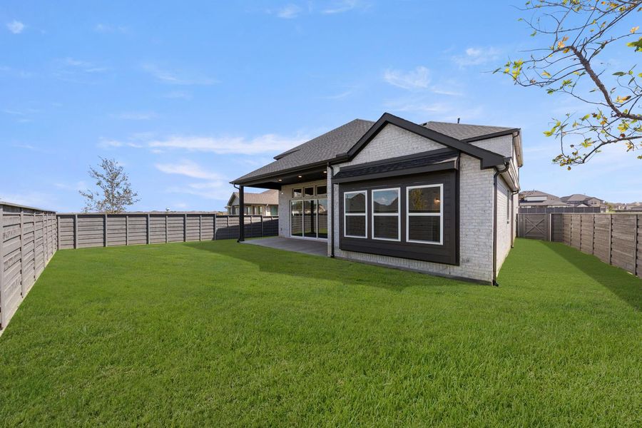 Exterior details and patio area of a home in Discovery Collection at Union Park, Little Elm (Image 17). Exterior details and patio area of a home in Discovery Collection at Union Park, Little Elm (Image 17).