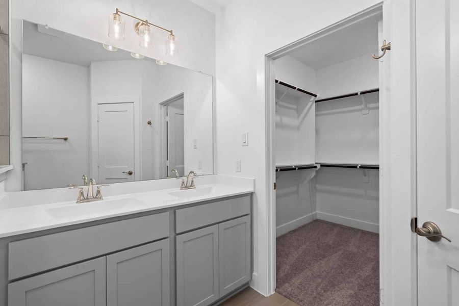 Furnished interior view inside a new home in Meridiana, Iowa Colony (Image 9).