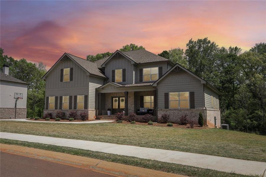 Front exterior of a new home in , Hoschton, GA, highlighting curb appeal (Image 31).