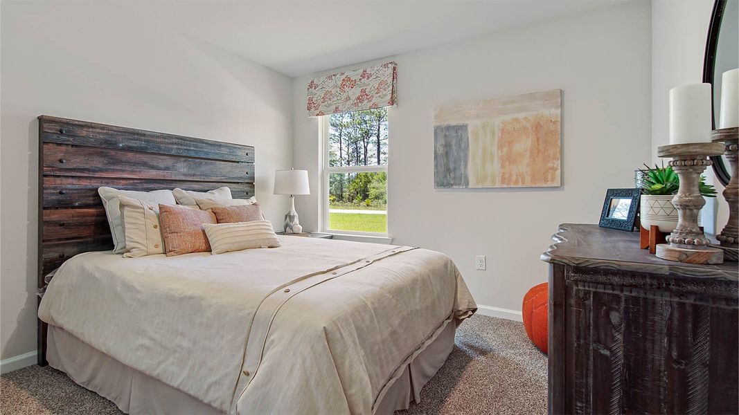 Representative furnished interior of a home built from the Cali by D.R. Horton in Owl's Head East, Freeport (Image 27).