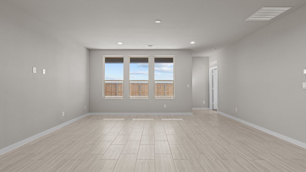 Representative unfurnished interior of a home built from the Jaxson by D.R. Horton in Legacy South, Midland (Image 14).