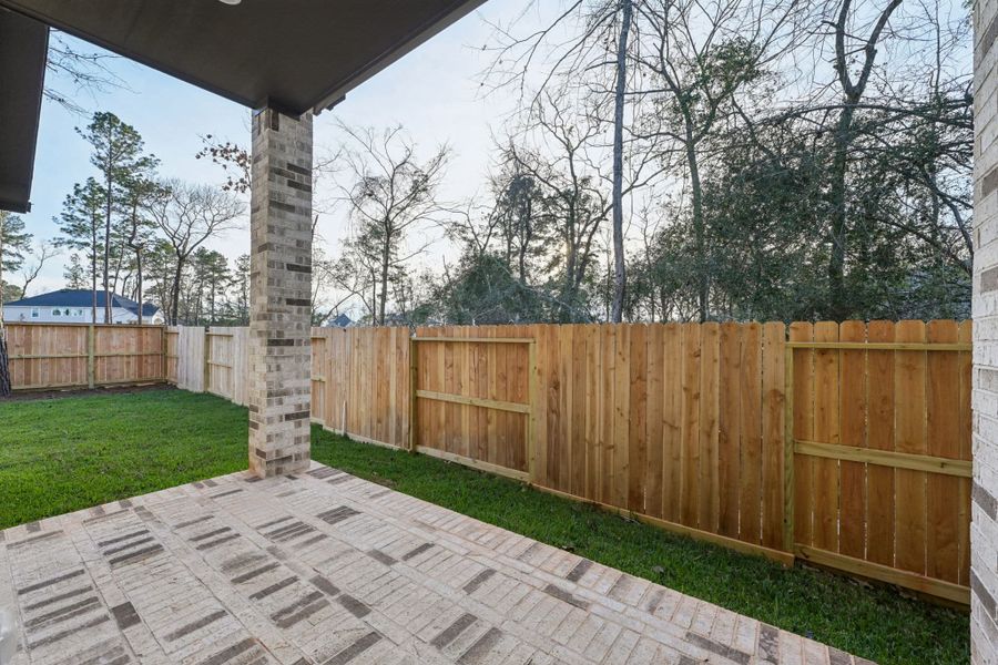 Exterior details and patio area of a home in The Woodlands Hills, Willis (Image 4).