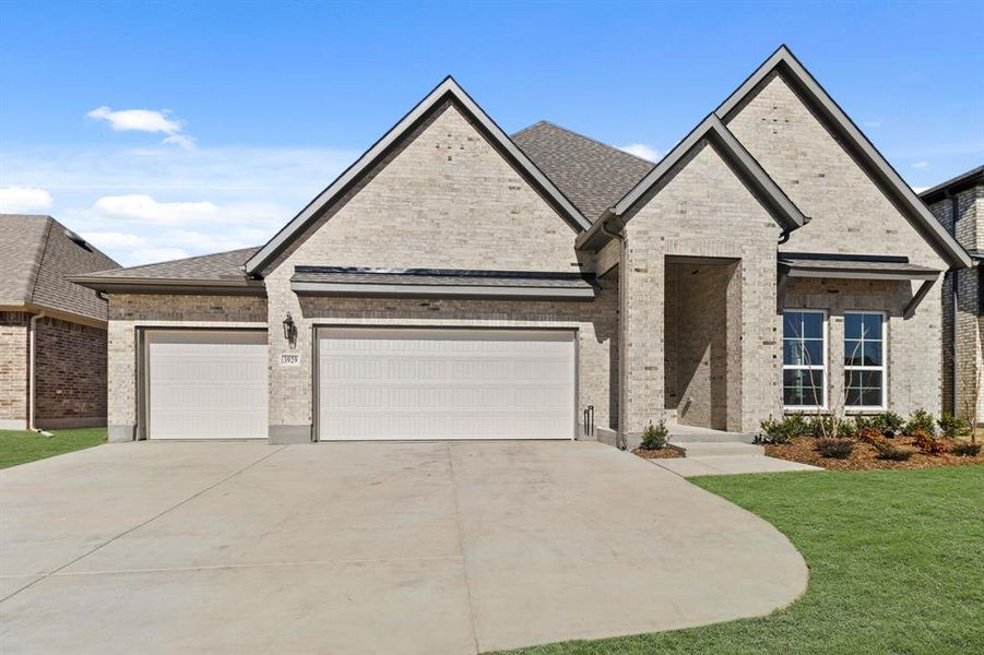 Front exterior of a new home in Lyons Crest Estates, Garland, TX, highlighting curb appeal (Image 2). Front exterior of a new home in Lyons Crest Estates, Garland, TX, highlighting curb appeal (Image 2).