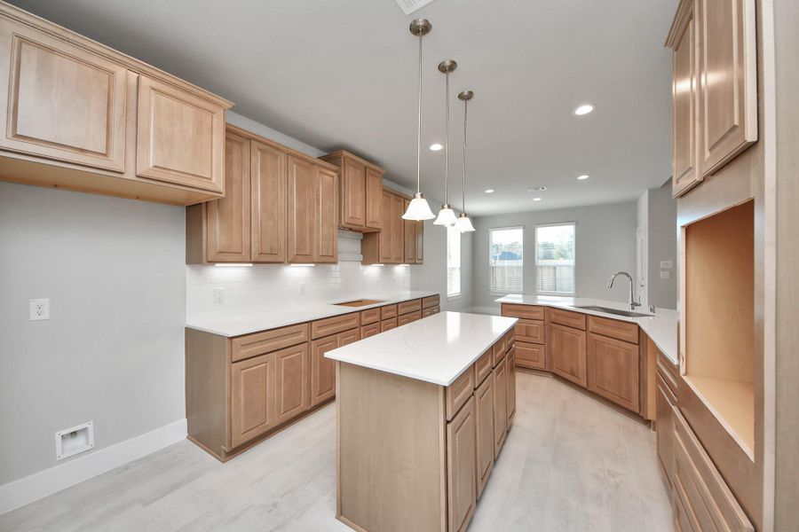 The extended counter area adds both practicality and style, making meal preparation a breeze. Every detail is thoughtfully designed to enhance the kitchen's functionality and aesthetic appeal.