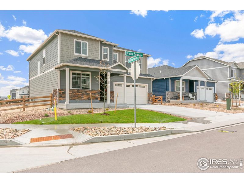 Front exterior of a new home in Vista Meadows, Fort Lupton, CO, highlighting curb appeal (Image 20). Front exterior of a new home in Vista Meadows, Fort Lupton, CO, highlighting curb appeal (Image 20).