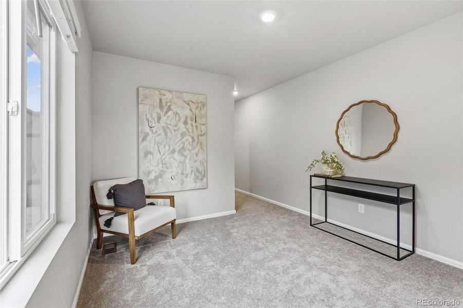 Furnished interior view inside a new home in Woodrose at Painted Prairie, Aurora (Image 17).