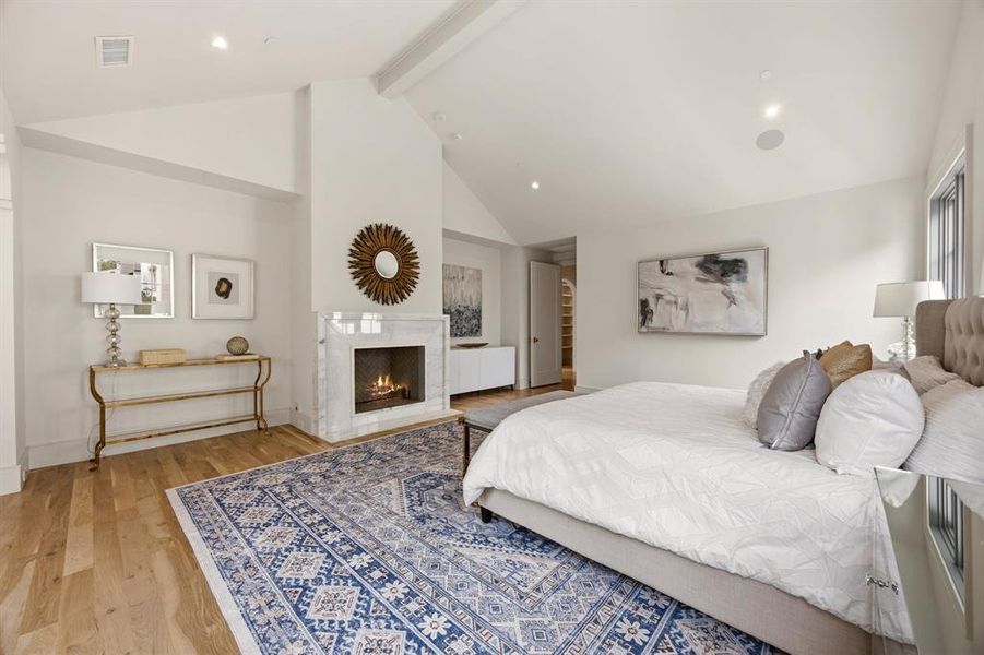 Spacious interior featuring a vaulted ceiling and light wood-finish flooring Spacious interior featuring a vaulted ceiling and light wood-finish flooring