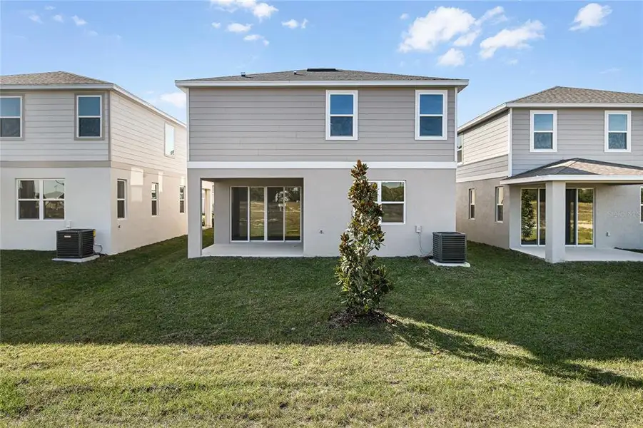 Exterior details and patio area of a home in Seasons at Aurora Oaks, Ocala (Image 3).