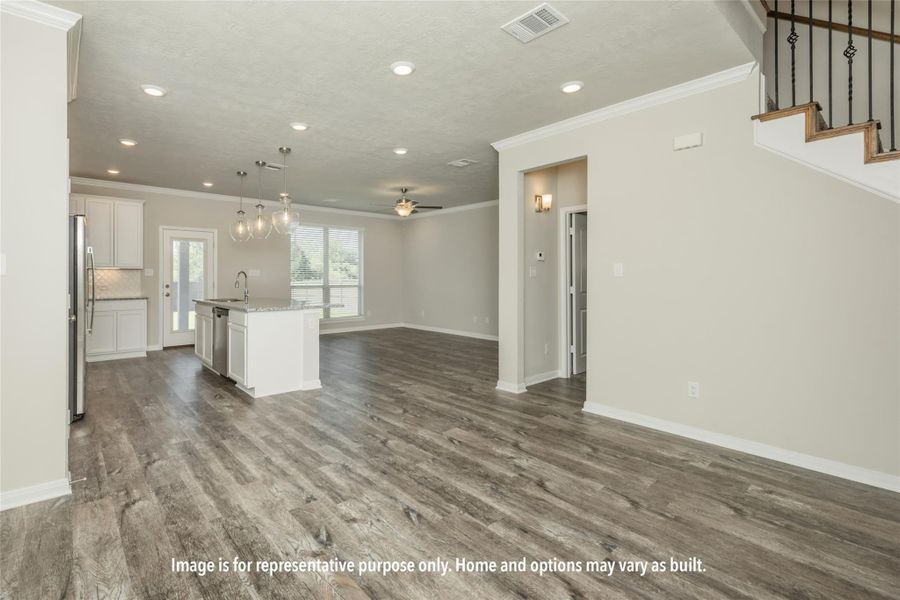Unfurnished living room with ornamental molding, recessed lighting, a ceiling fan, and dark wood-style floors