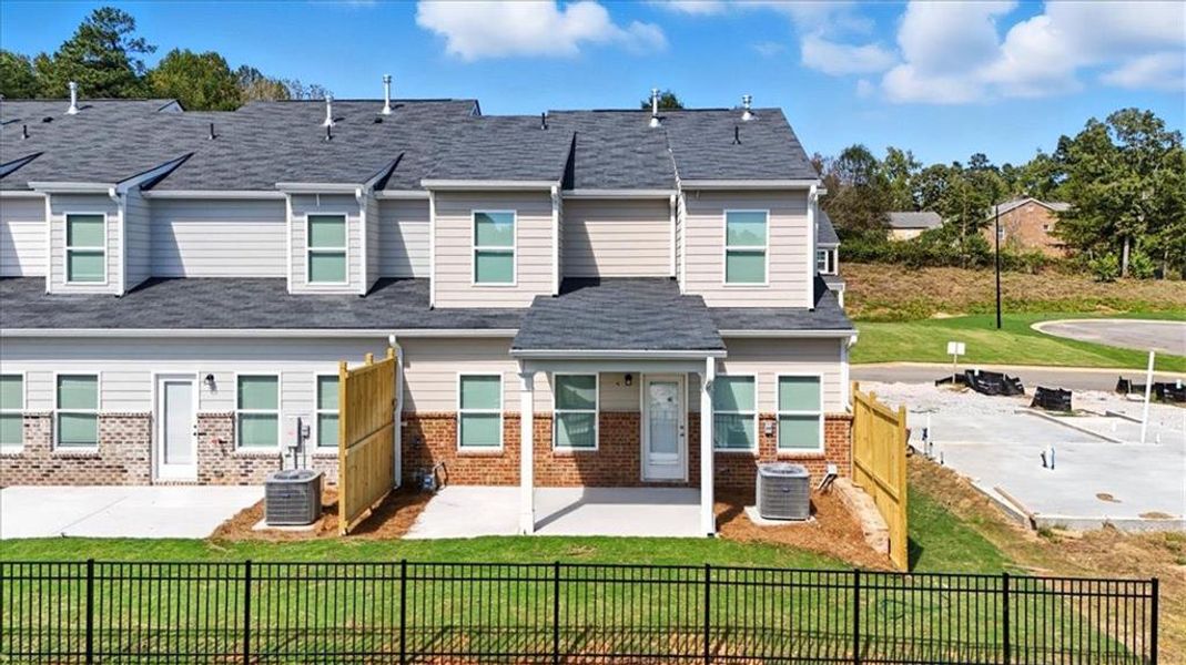 Exterior details and patio area of a home in Park Center Pointe, Austell (Image 3).