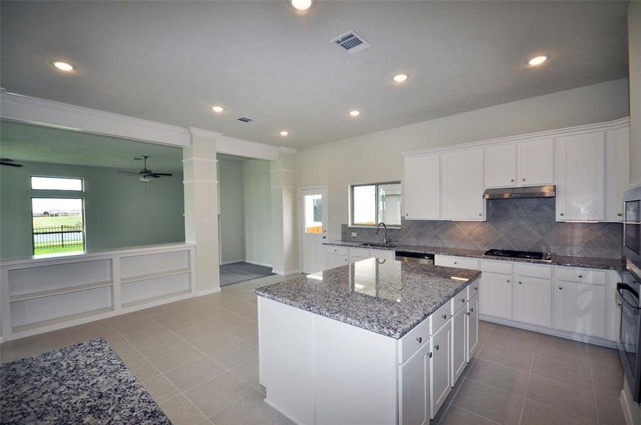 Enjoy this view across the kitchen and breakfast room into the Family Room and beyond.