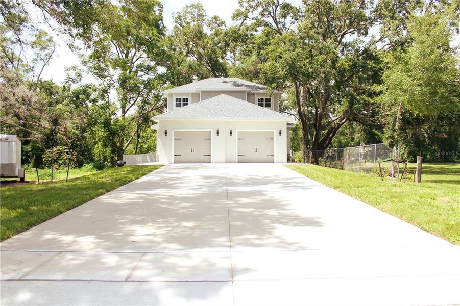 Front exterior of a new home in , Leesburg, FL, highlighting curb appeal (Image 2). Front exterior of a new home in , Leesburg, FL, highlighting curb appeal (Image 2).