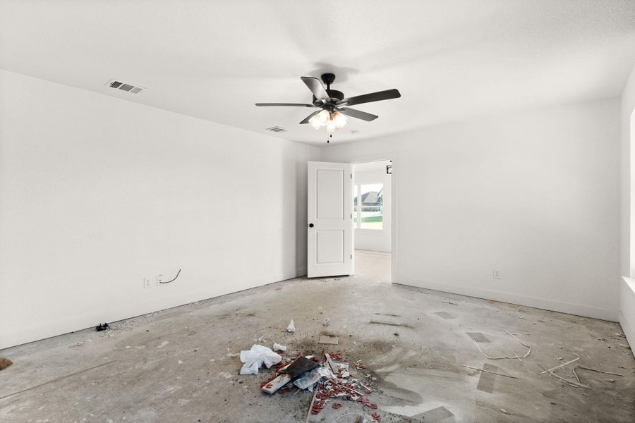 Empty room featuring ceiling fan Empty room featuring ceiling fan
