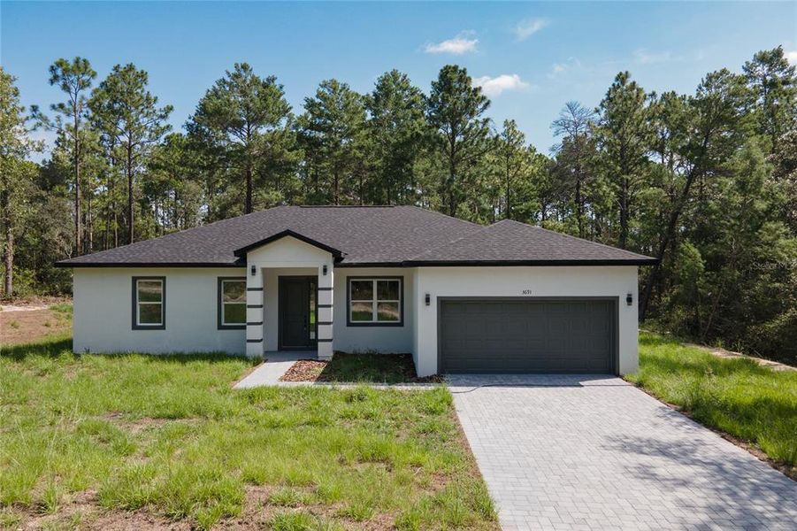 Front exterior of a new home in , Dunnellon, FL, highlighting curb appeal (Image 24). Front exterior of a new home in , Dunnellon, FL, highlighting curb appeal (Image 24).