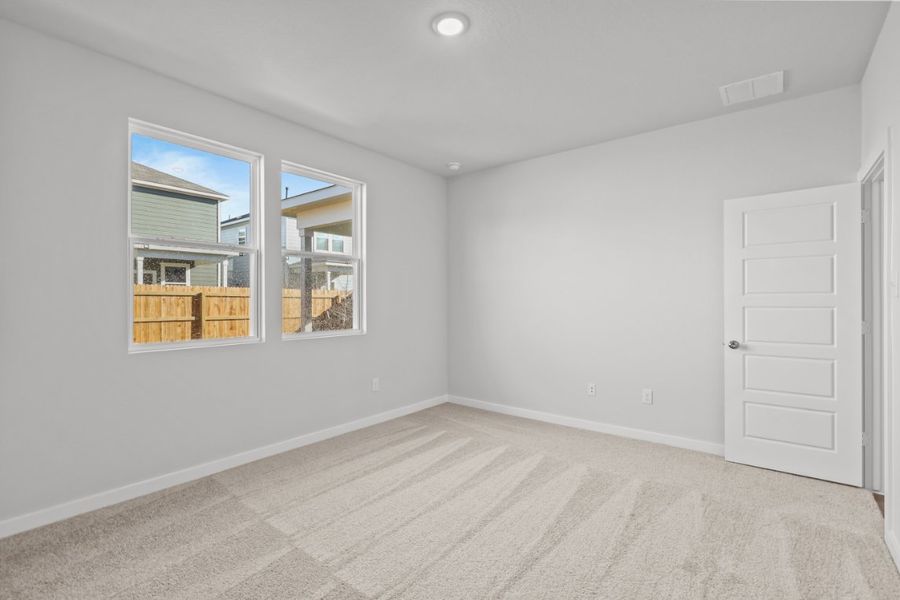 A room with a window and a door.