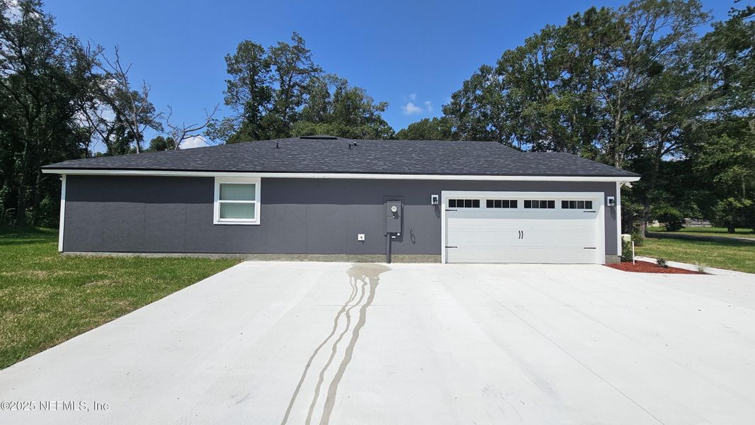 Front exterior of a new home in , Jacksonville, FL, highlighting curb appeal (Image 23).