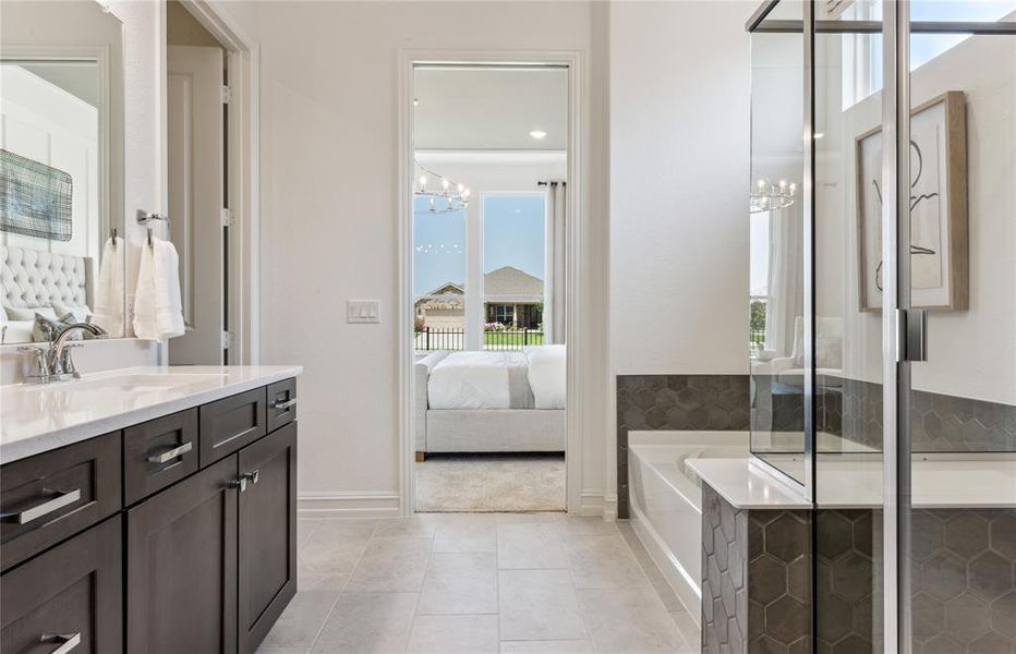 Private owner's bath with separate shower and tub *actual home pictured, furniture not included Private owner's bath with separate shower and tub *actual home pictured, furniture not included