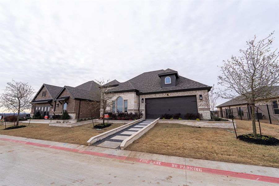 Front exterior of a new home in , Little Elm, TX, highlighting curb appeal (Image 20).