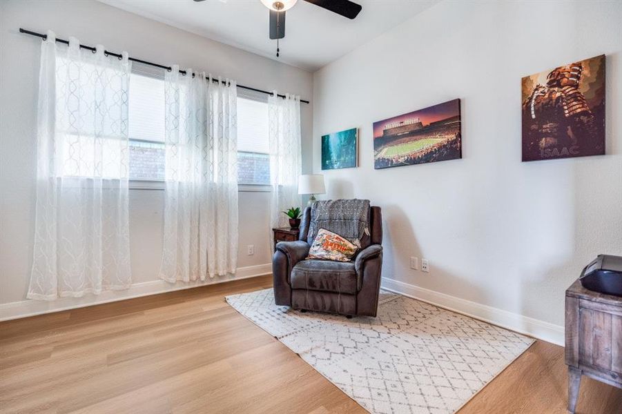 Sitting room featuring wood finished floors and ceiling fan