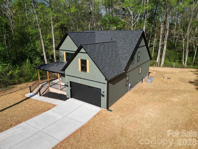 Front exterior of a new home in , Statesville, NC, highlighting curb appeal (Image 23).