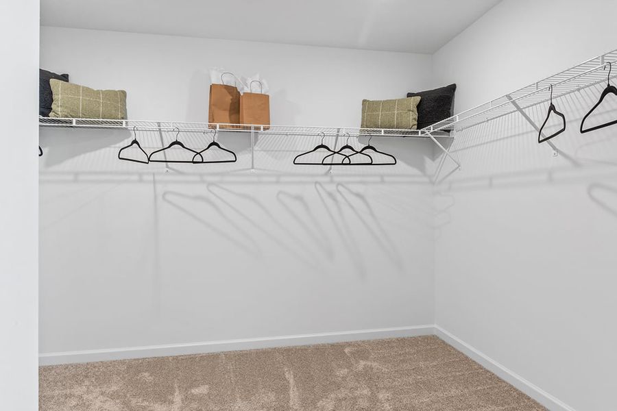 A bed with a white sheet.