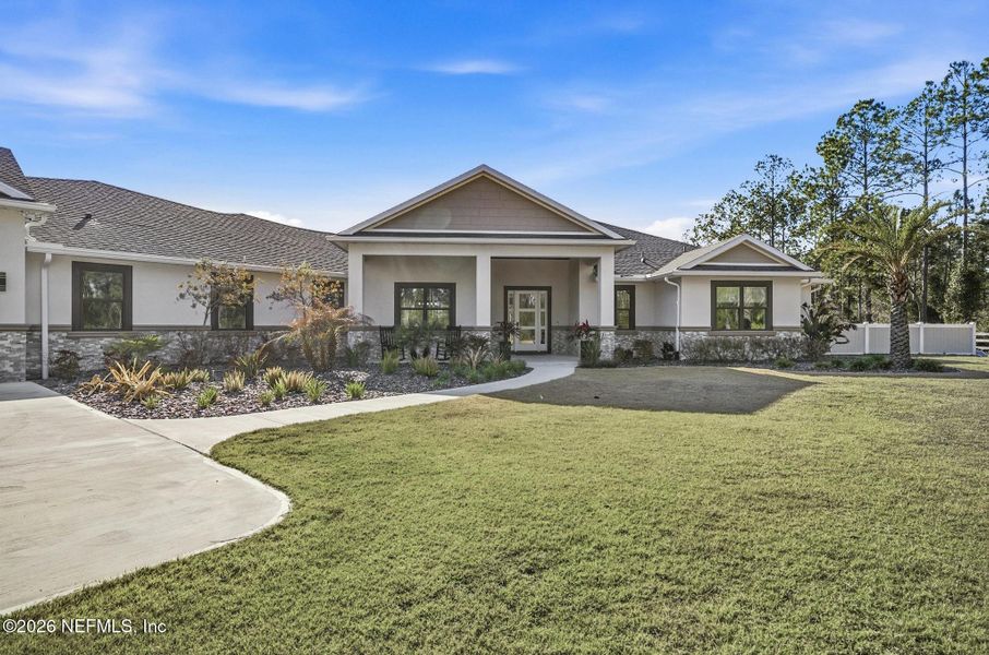 Front exterior of a new home in , Palm Coast, FL, highlighting curb appeal (Image 24). Front exterior of a new home in , Palm Coast, FL, highlighting curb appeal (Image 24).