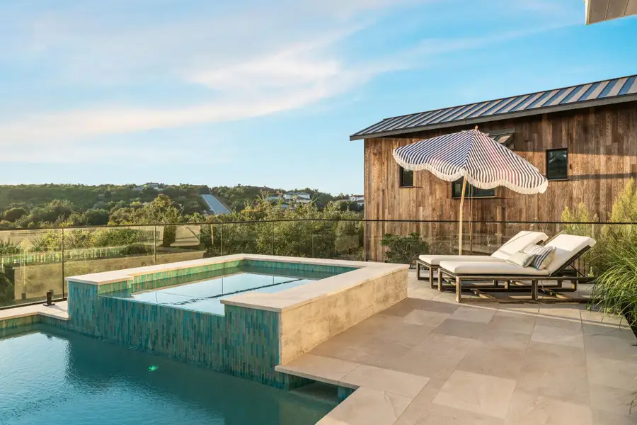 View of swimming pool featuring a patio area View of swimming pool featuring a patio area