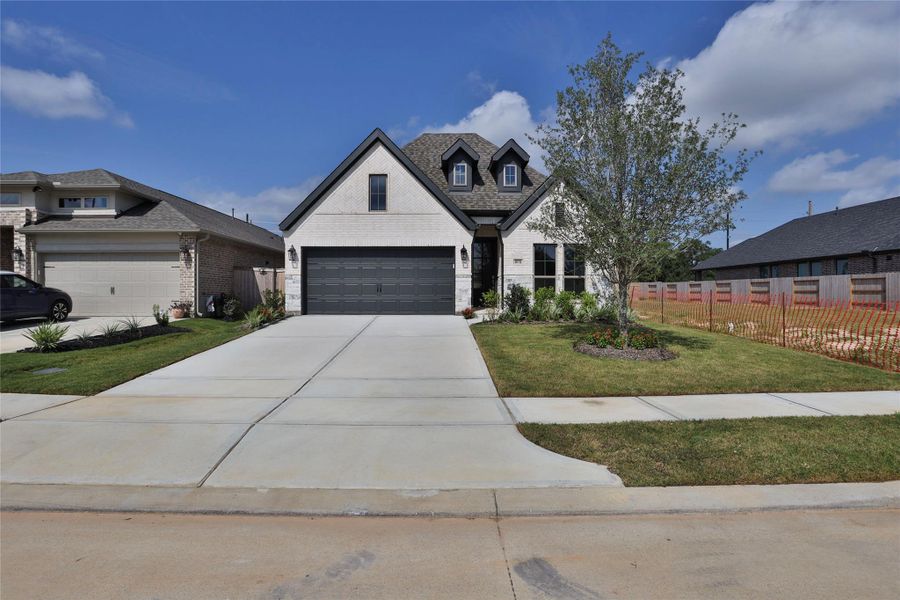 Front exterior of a new home in Everly, Hockley, TX, highlighting curb appeal (Image 2).