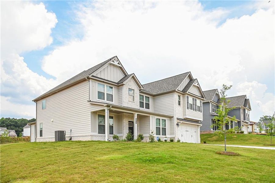 Front exterior of a new home in , Stockbridge, GA, highlighting curb appeal (Image 32).