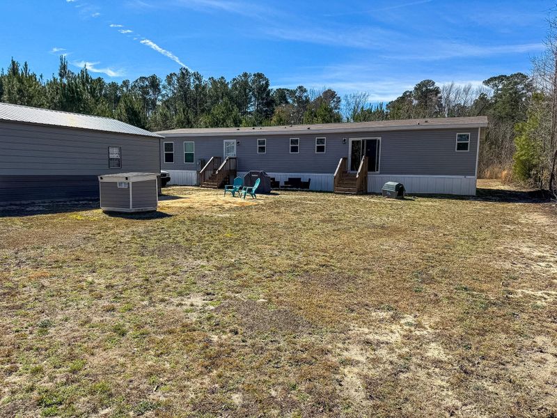 Exterior details and patio area of a home in , Cottageville (Image 19).
