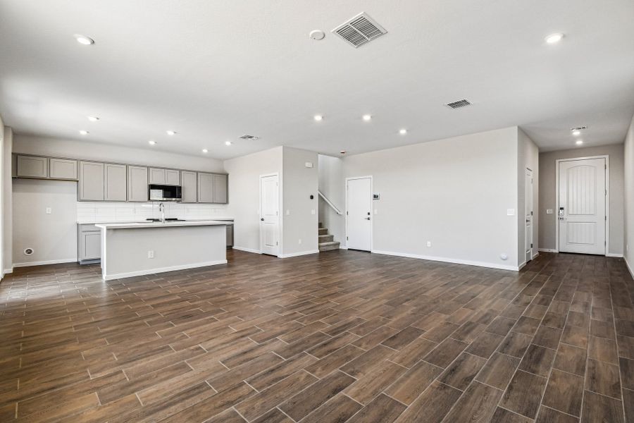 A large empty room with white cabinets. A large empty room with white cabinets.