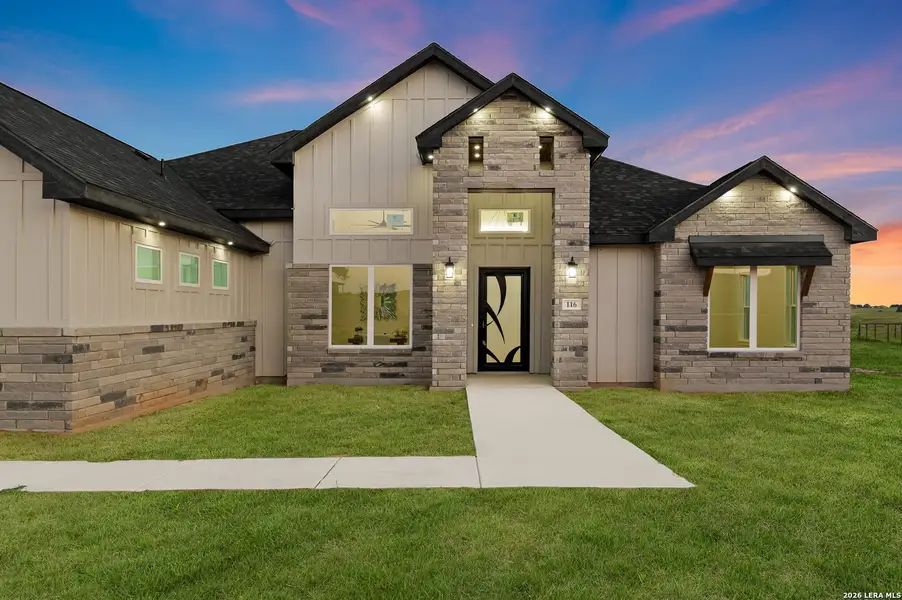 Front exterior of a new home in , La Vernia, TX, highlighting curb appeal (Image 1). Front exterior of a new home in , La Vernia, TX, highlighting curb appeal (Image 1).