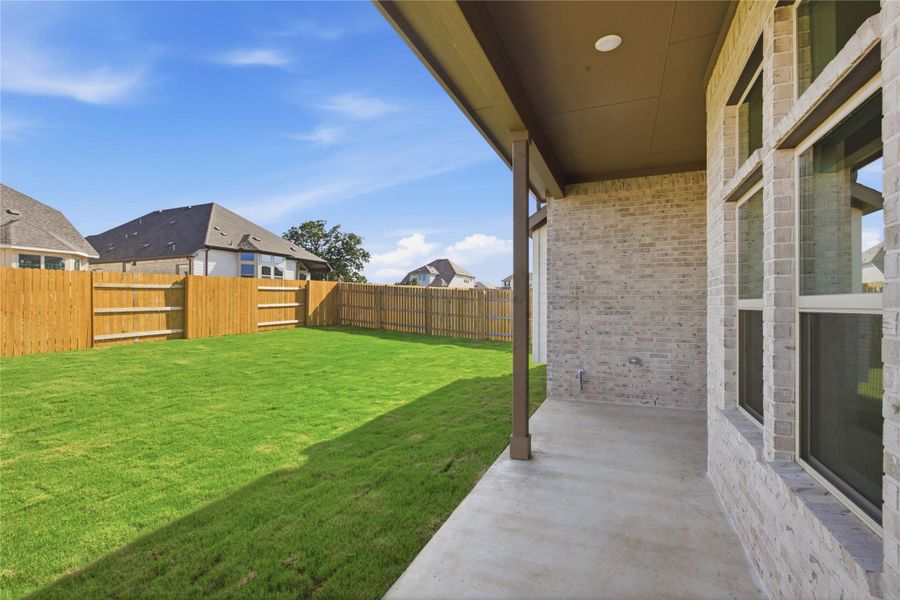 Exterior details and patio area of a home in Oaks at San Gabriel, Georgetown (Image 21).