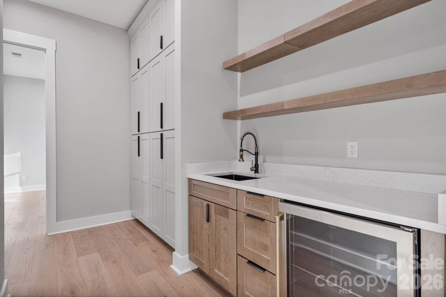 Wet bar and custom hallway cabinets