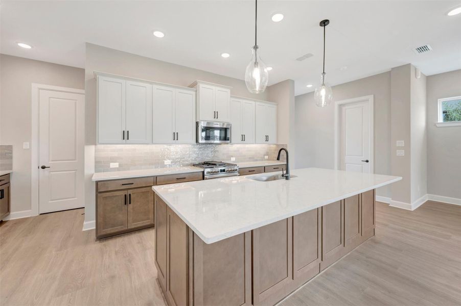 Furnished interior view inside a new home in Pomona - Grove Row Collection, Manvel (Image 5).