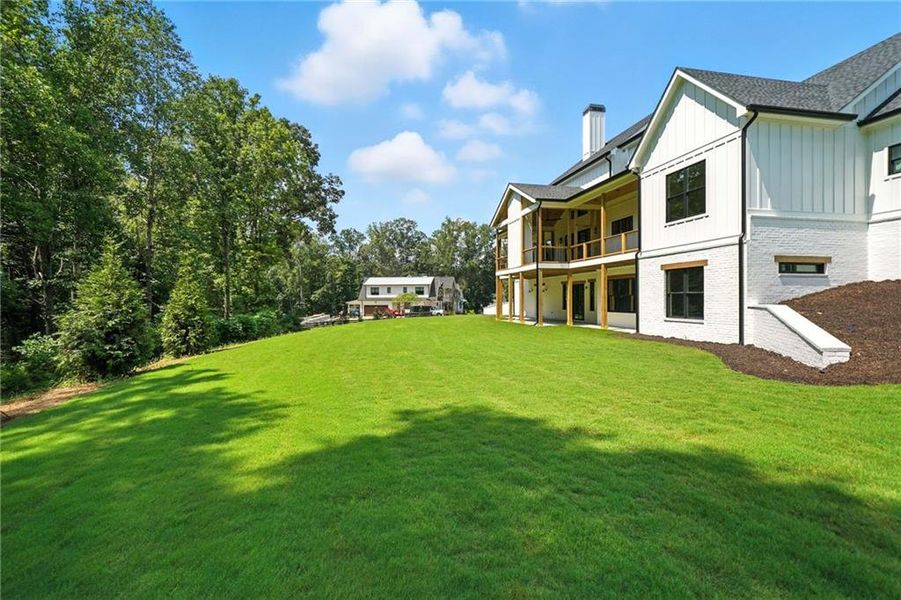Front exterior of a new home in , Canton, GA, highlighting curb appeal (Image 1).