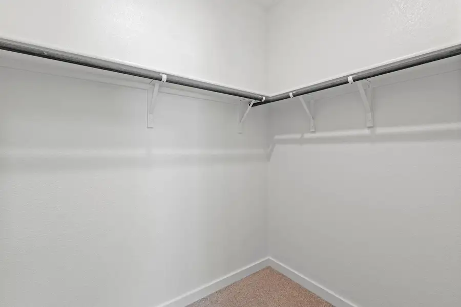 Ample closet space with sturdy hanging rods ensures organized storage. Ample closet space with sturdy hanging rods ensures organized storage.