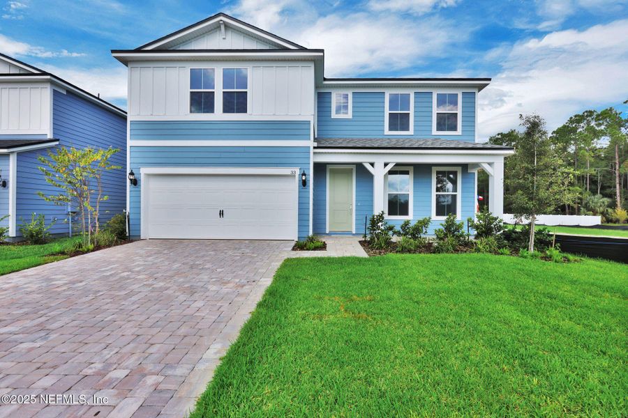 Front exterior of a new home in The Preserve at Bannon Lakes, St. Augustine, FL, highlighting curb appeal (Image 1). Front exterior of a new home in The Preserve at Bannon Lakes, St. Augustine, FL, highlighting curb appeal (Image 1).