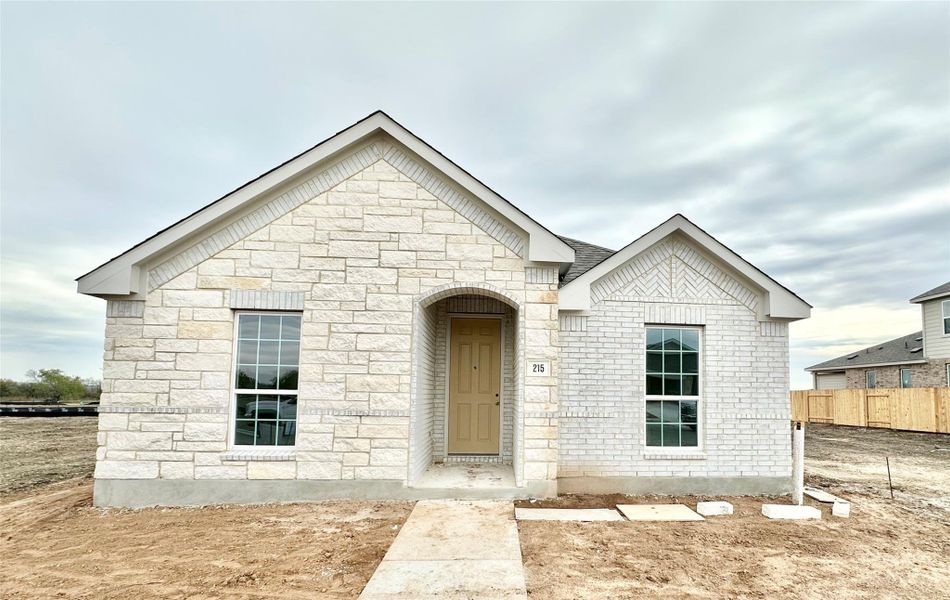 View of front of home featuring stone siding