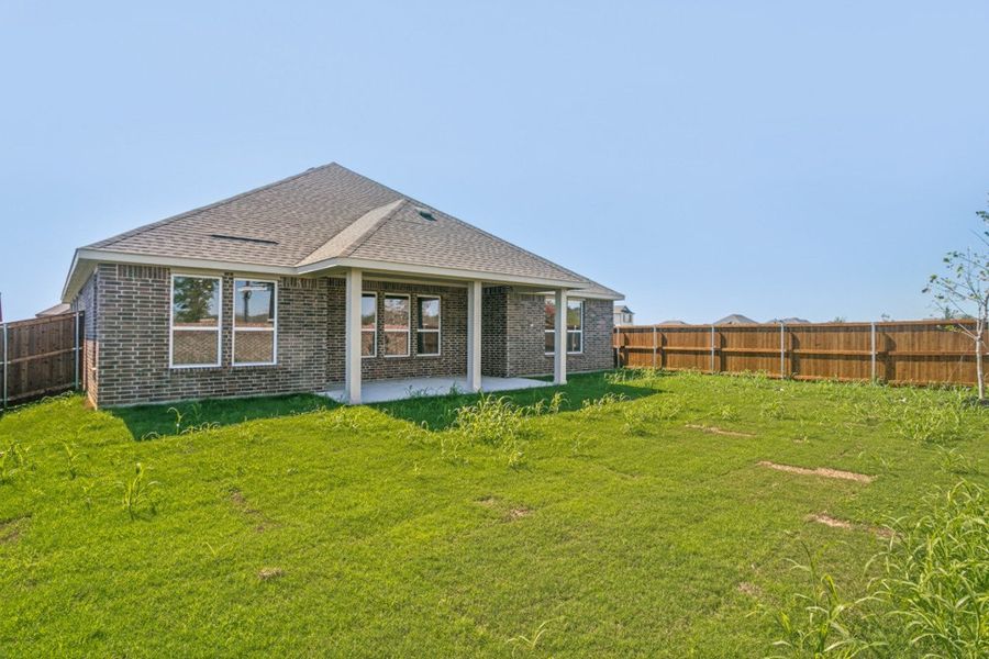 Exterior details and patio area of a home in The Preserve Estates, Justin (Image 19).