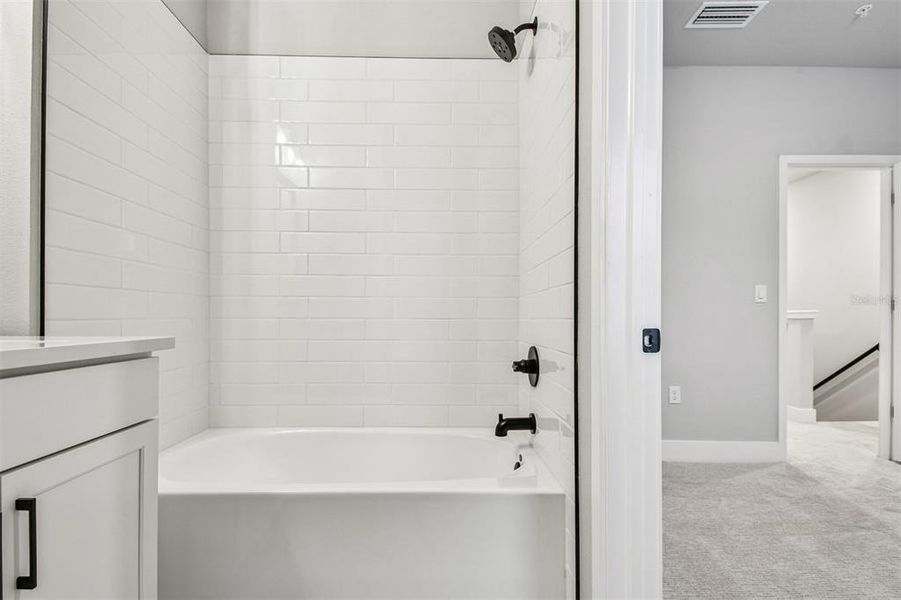 Furnished interior view inside a new home in Towns at Union, St. Petersburg (Image 15).